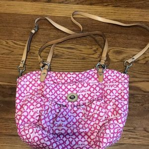Pink leather coach bag.